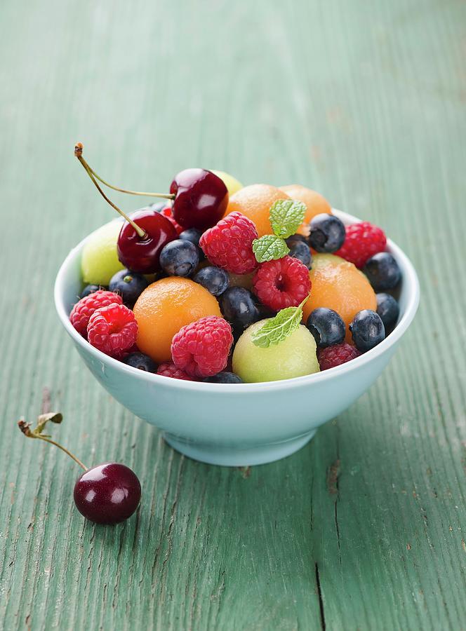 Fruit Salad With Berries, Melon Balls And Cherries Photograph by Ewgenija Schall