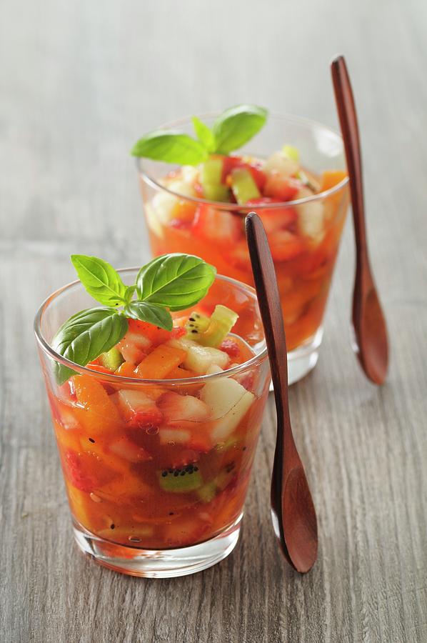 Fruit Salad With Strawberry, Apricot, Peaches, Kiwi And Basil Photograph by Jean-christophe Riou