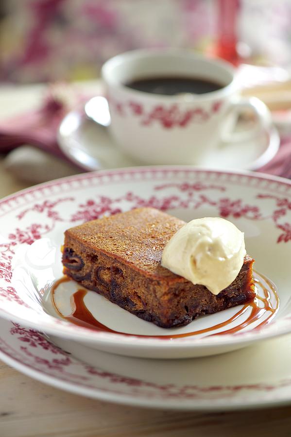Fruitcake With Vanilla Ice Cream And Caramel Sauce Photograph by Winfried Heinze