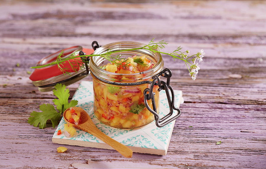 Fruity And Sour Papaya Salsa In A Glass Jar Photograph by Teubner Foodfoto