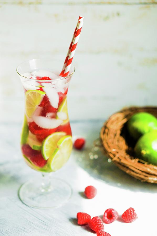 Fruity Iced Tea In A Long Drink Glass With A Straw Photograph by Alena Haurylik