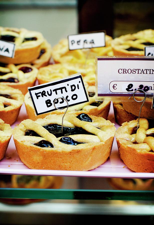 Frutti Di Bosco forest Fruits Tartlets On Display In An Italian Bakery Photograph by Jamie Watson