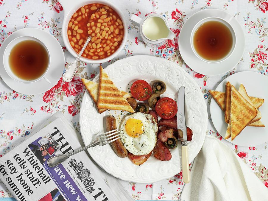 Full English Breakfast Including Bacon, Fried Egg, Toast, Baked Beans And A Cup Of Tea Photograph by Kng, Ruth