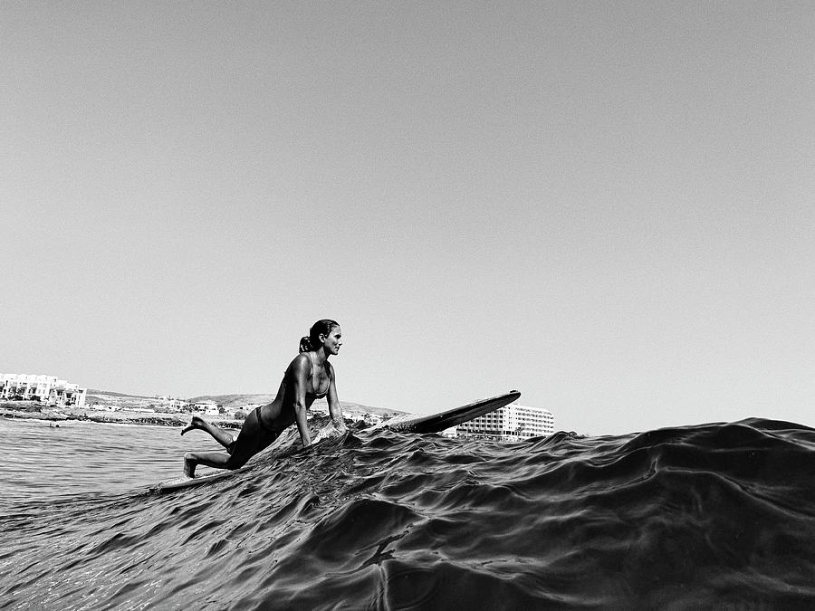Full Length Of A Female Surfer On Her Longboard, Black And White Photograph by Cavan Images