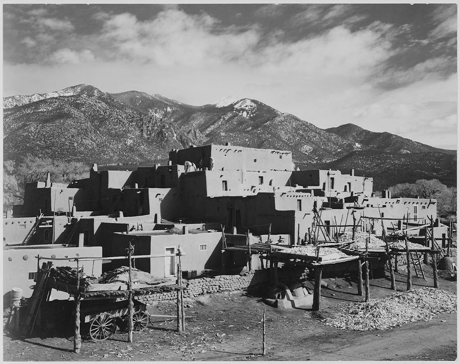 Full view of city mountains in background Taos Pueblo National Historic Landmark New Mexico 1941. 1941 Painting by Ansel Adams