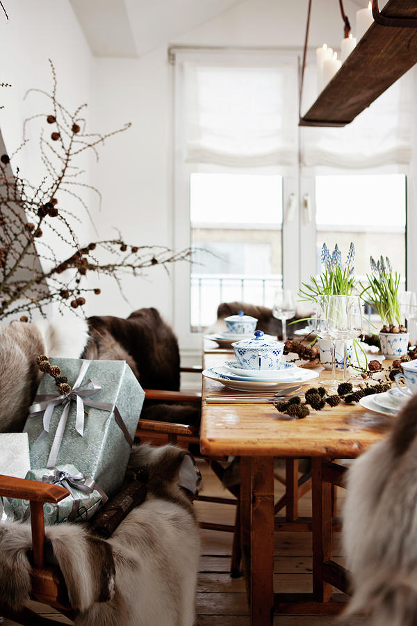 Fur Blanket And Christmas Presents Next To Set Wooden Table Photograph by Lykke Foged & Morten Holtum