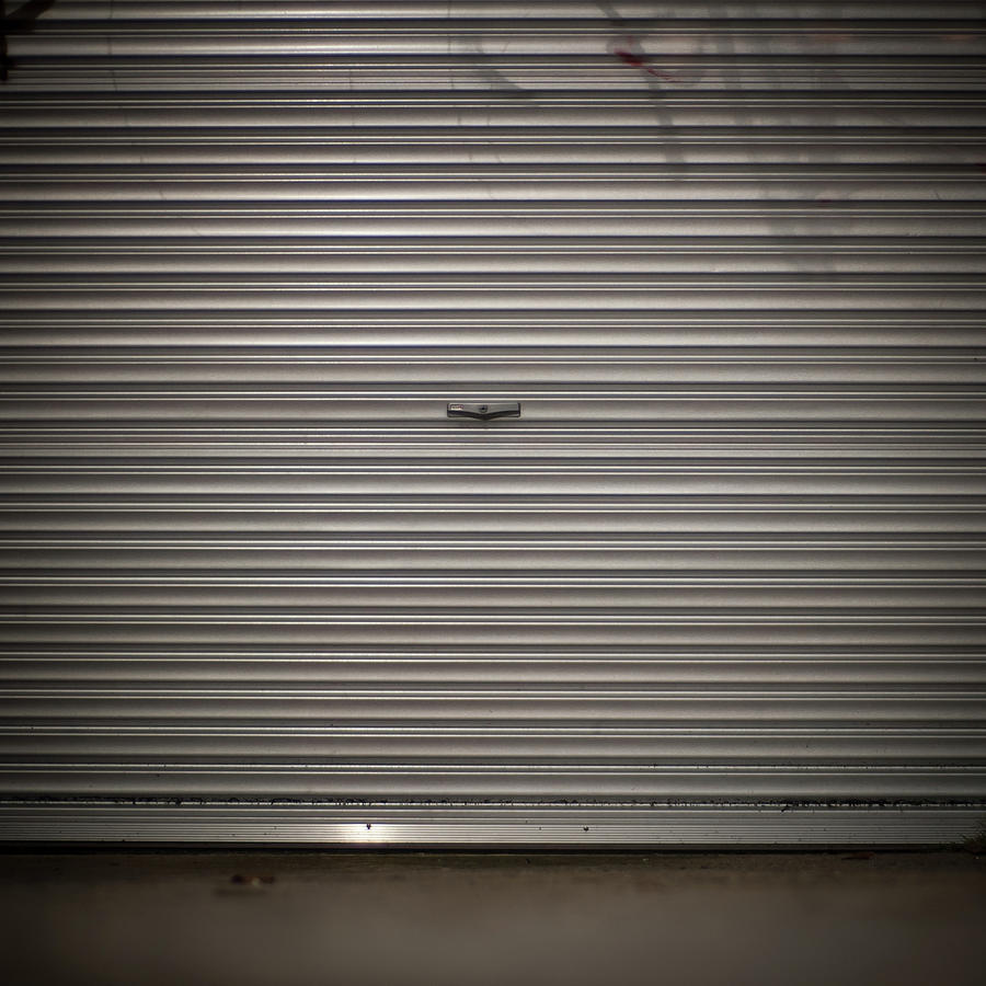 Garage Door At Night Photograph by John Abbate