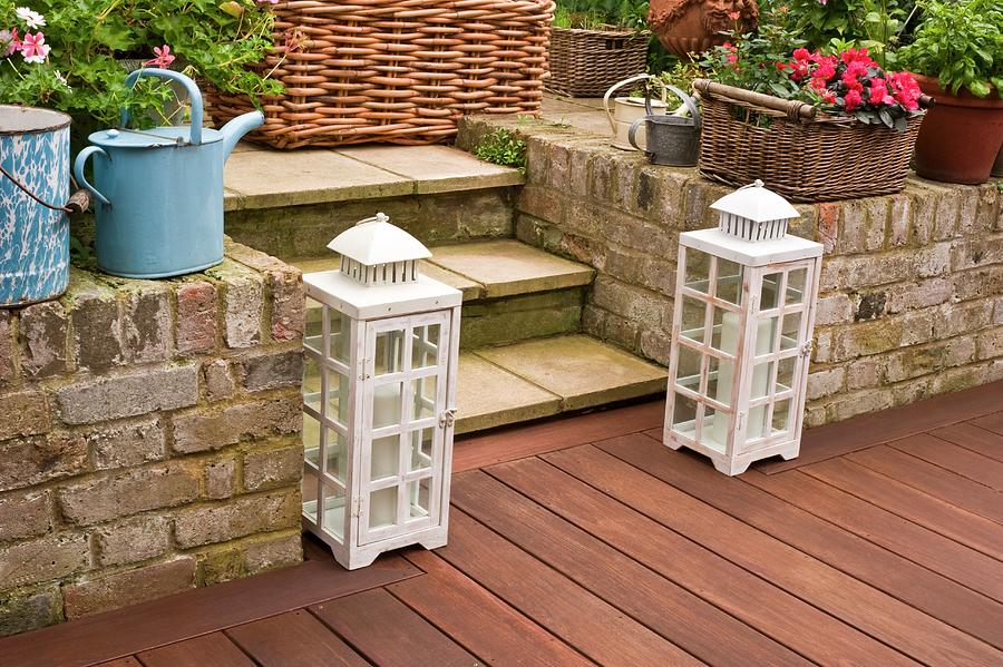 Garden Lanterns On Terrace With Wooden Decking Photograph by Linda Burgess