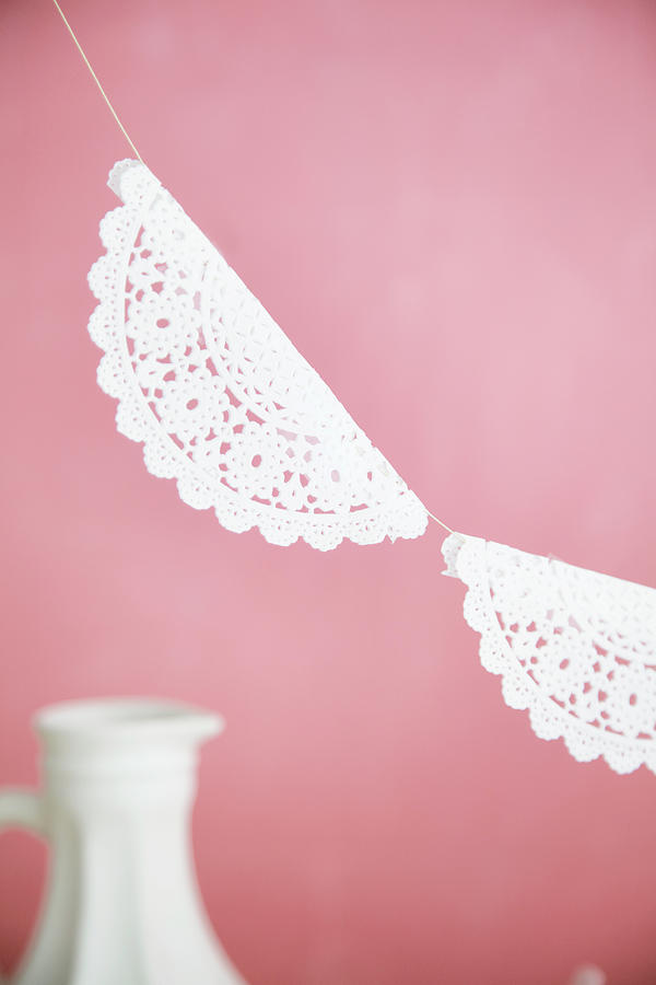 Garland Of Lacy Paper Doilies Photograph by Nicoline Olsen