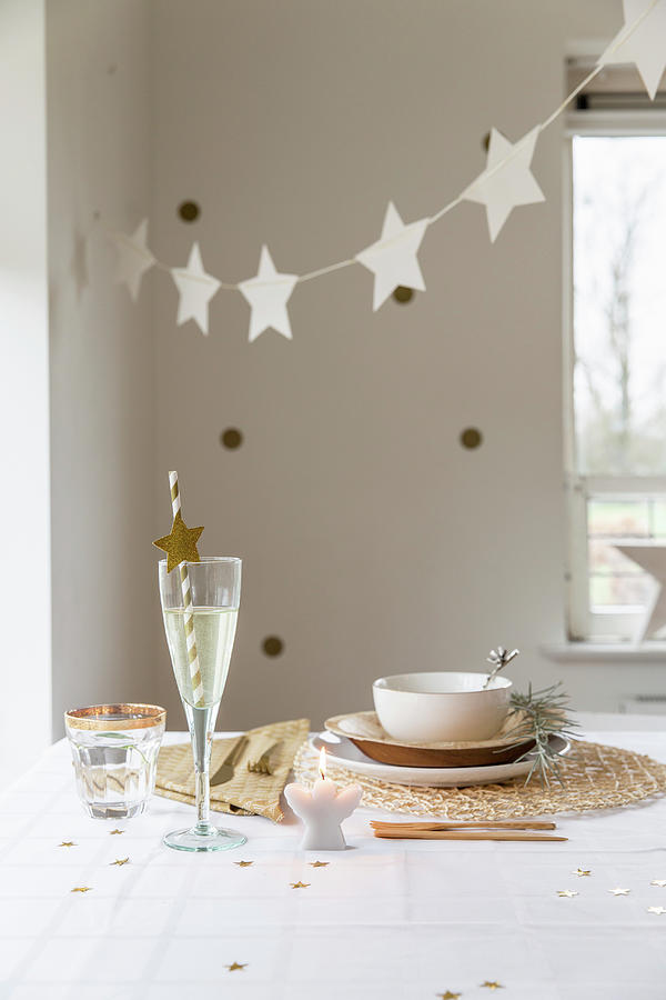 Garland Of Stars Above Table Set In Natural Shades And With Natural Materials Photograph by Studio Lumino