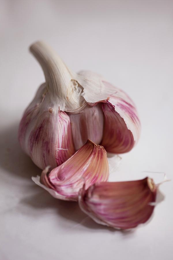 Garlic Bulb With Garlic Cloves Photograph by Hilde Mche