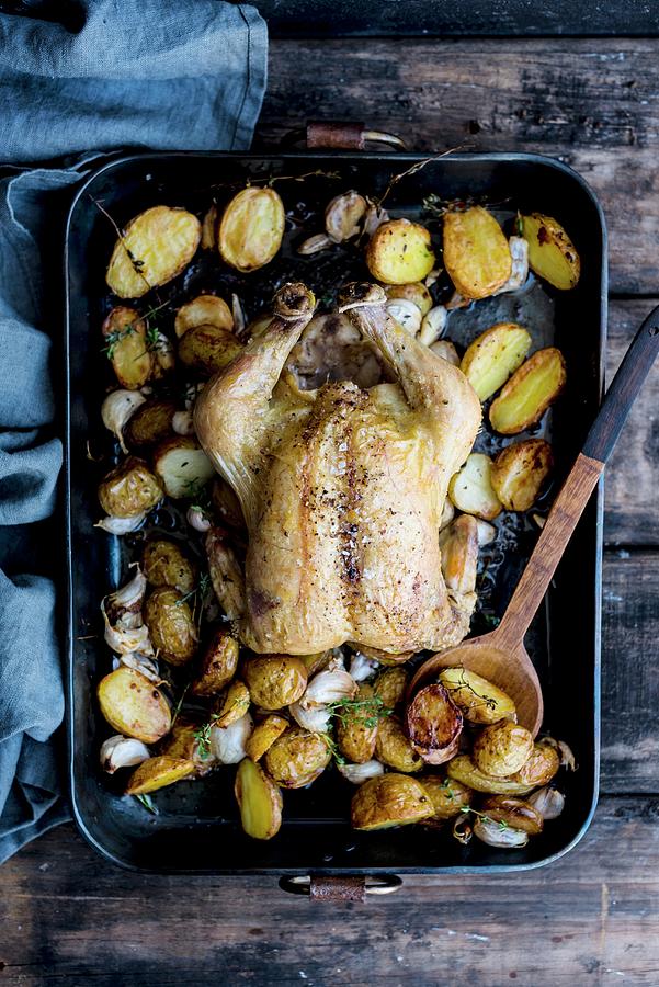 Garlic Chicken With Potatoes In A Roasting Tray top View Photograph by Hein Van Tonder