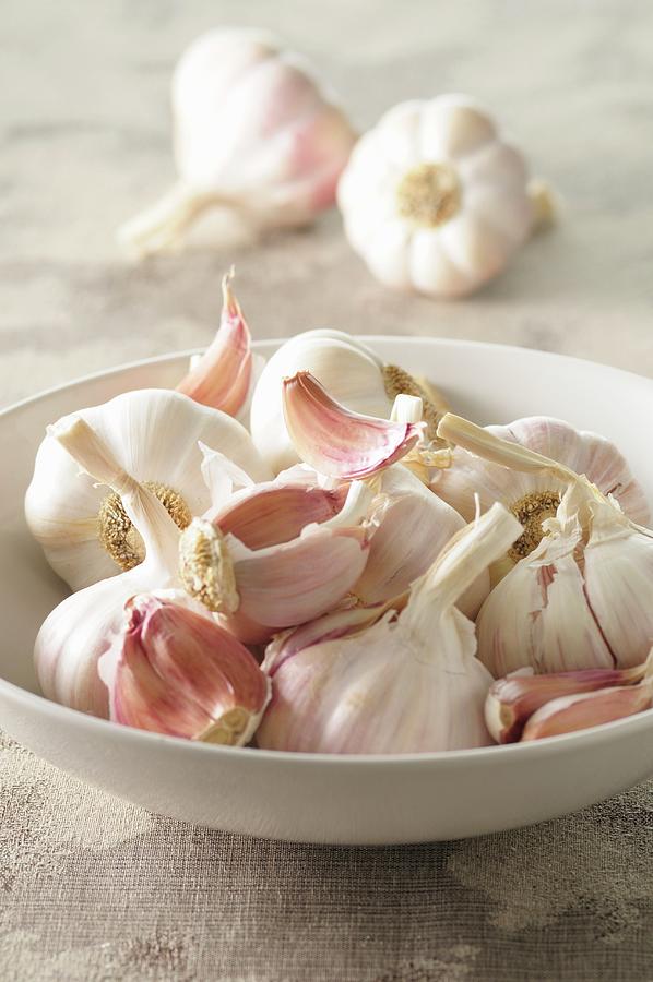 Garlic In A White Bowl Photograph by Jean-christophe Riou