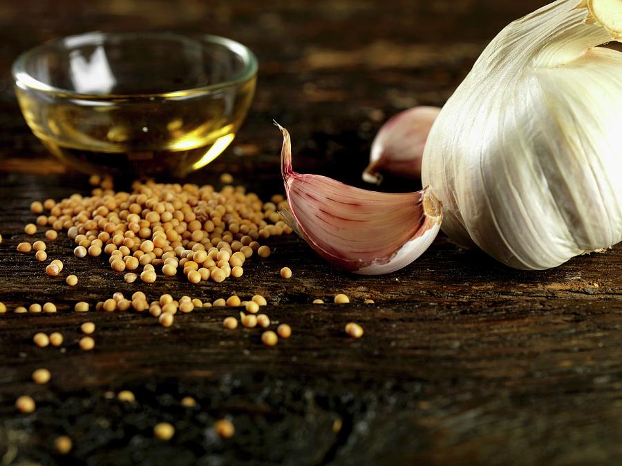 Garlic, Mustard Seeds And Olive Oil Photograph by Robert Morris
