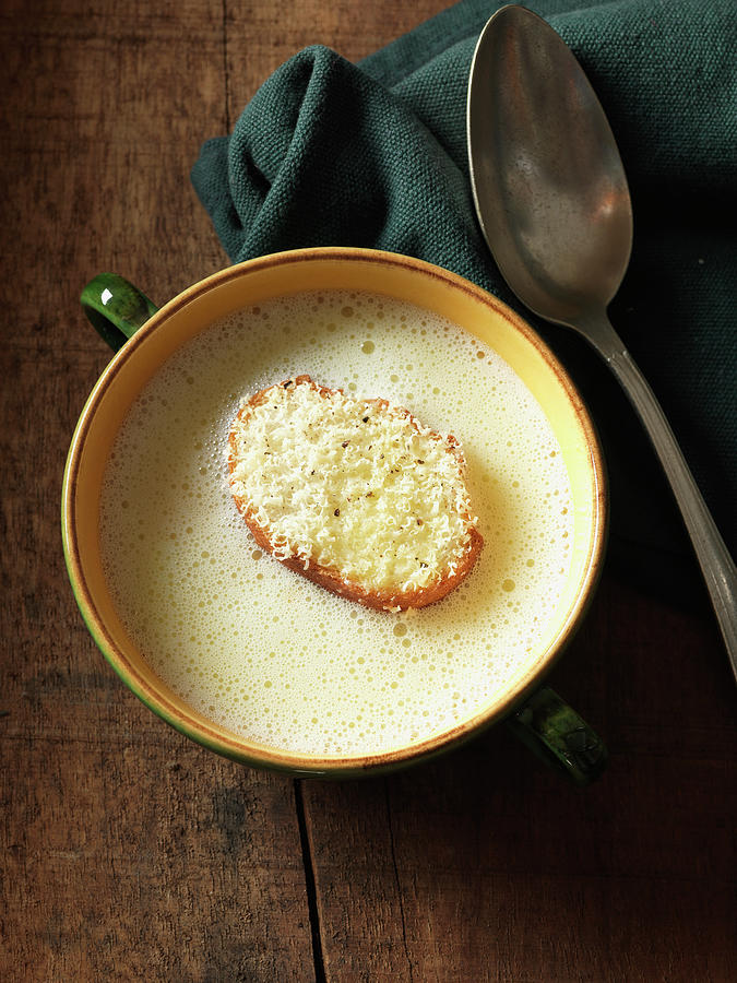 Garlic Soup With A Giant Cheese Crouton Photograph by Andreas Thumm