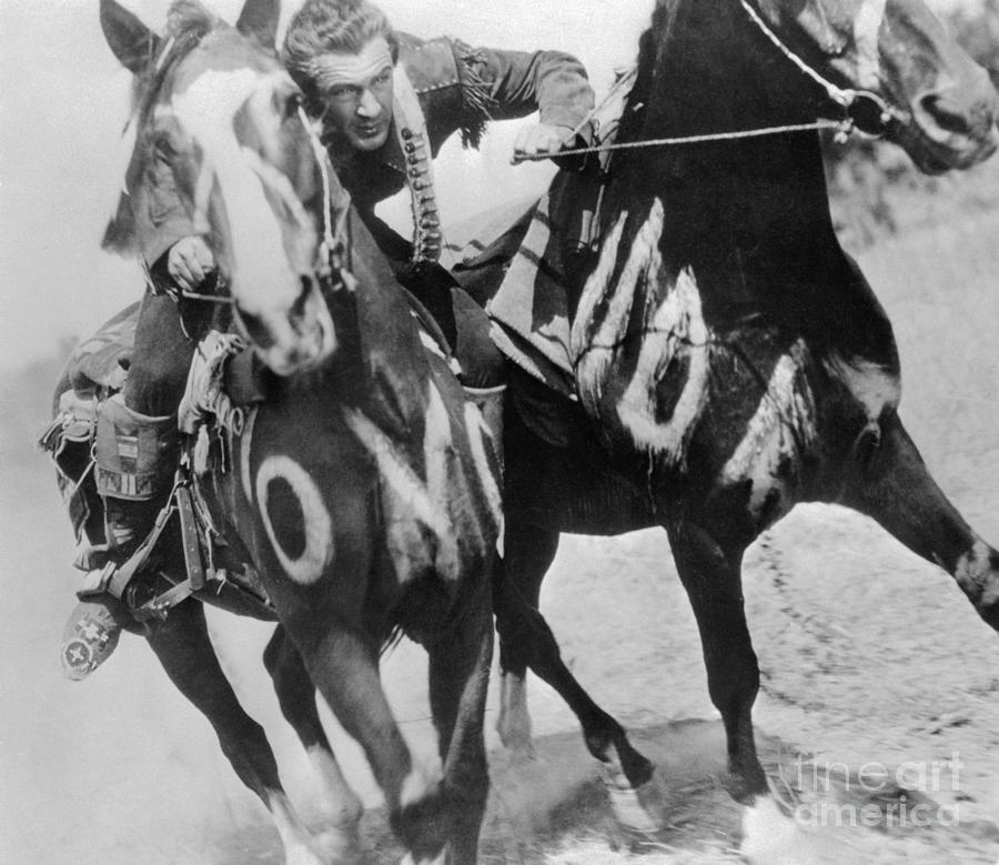 Gary Cooper In Western Scene With Horses Photograph by Bettmann