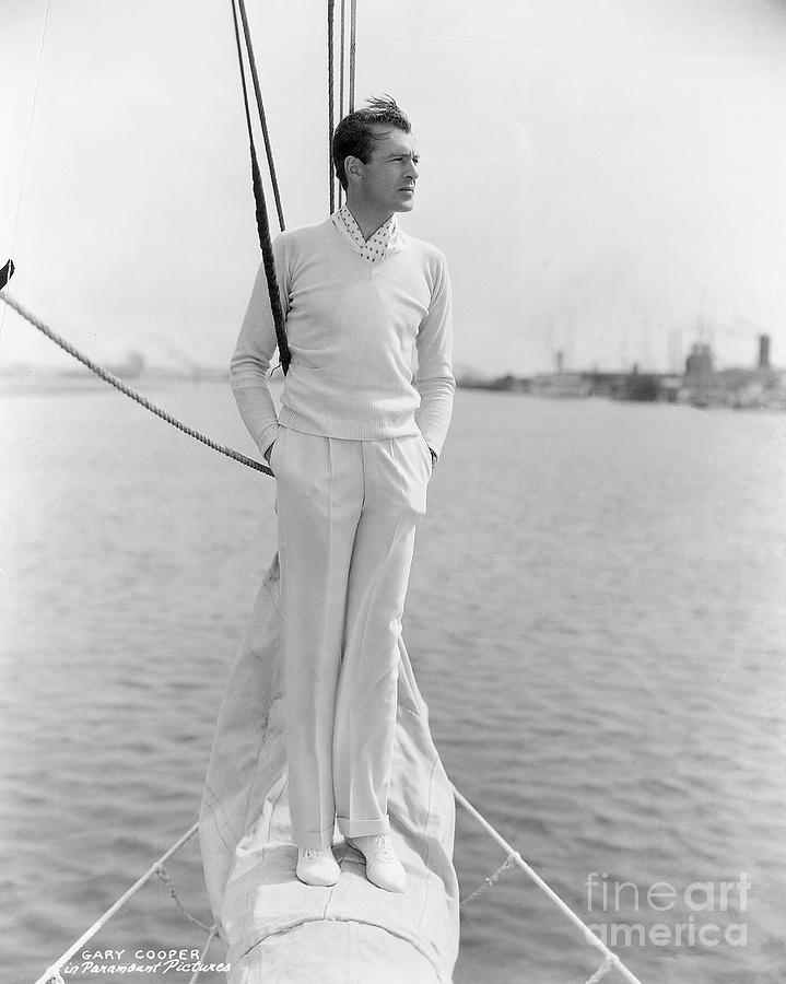 Gary Cooper On Prow Of Sailboat Photograph by Bettmann