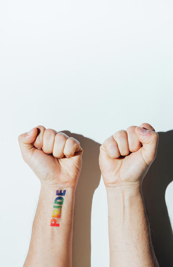 Gay Photograph - Gay Guys Hand With A Tattoo That Says Pride And Nail Polish. by Cavan Images