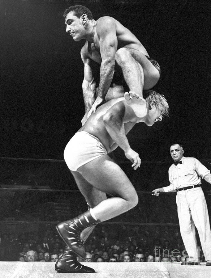 Gene Stanlee Leaps Over Antonio Rocca Photograph by New York Daily News Archive