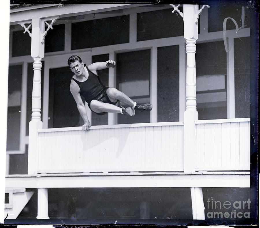 Gene Tunney Leaping Over Porch Wall Photograph by Bettmann