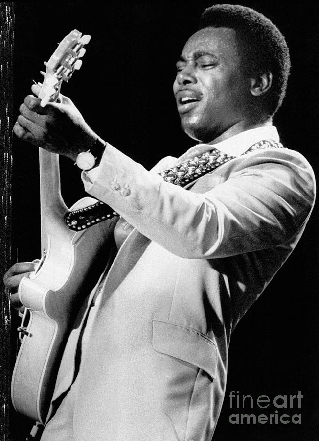 George Benson Playing Guitar On Stage Photograph by Bettmann