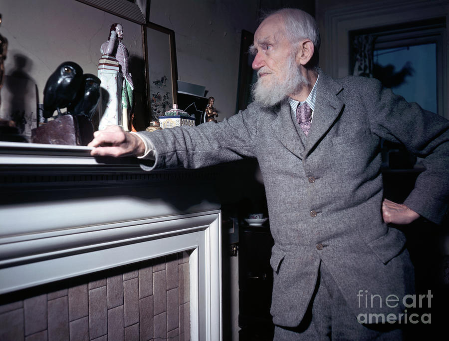 Portrait Photograph - George Bernard Shaw Standing At Mantel by Bettmann
