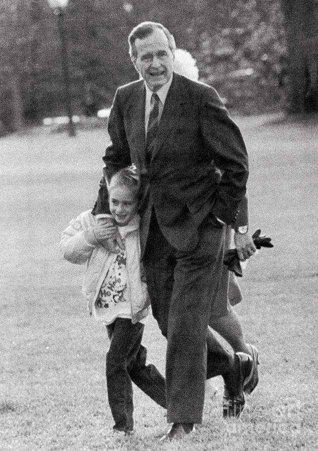 George Bush Embracing And Strolling Photograph by Bettmann