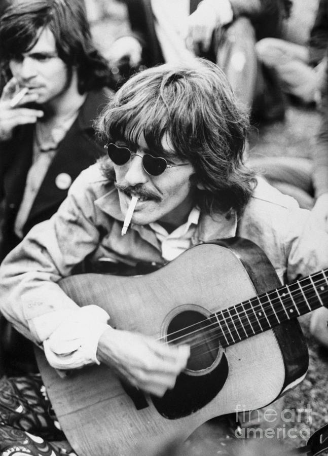George Harrison Photograph - George Harrison Playing Guitar by Bettmann
