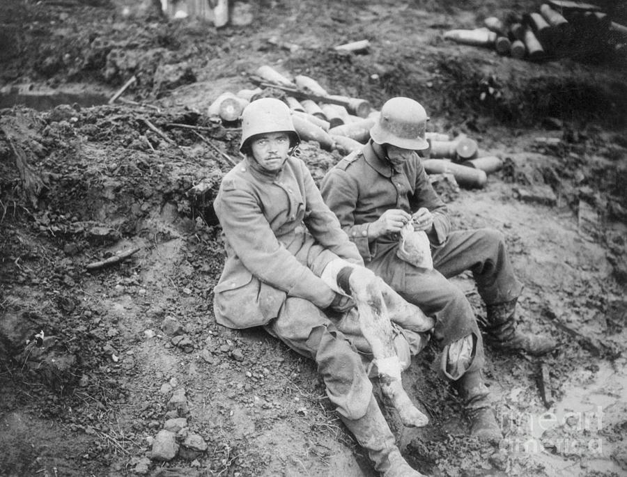 Portrait Photograph - German Soldier Tending To Wounds by Bettmann