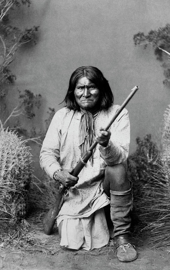 Geronimo Kneeling With Rifle - 1886 Photograph by War Is Hell Store