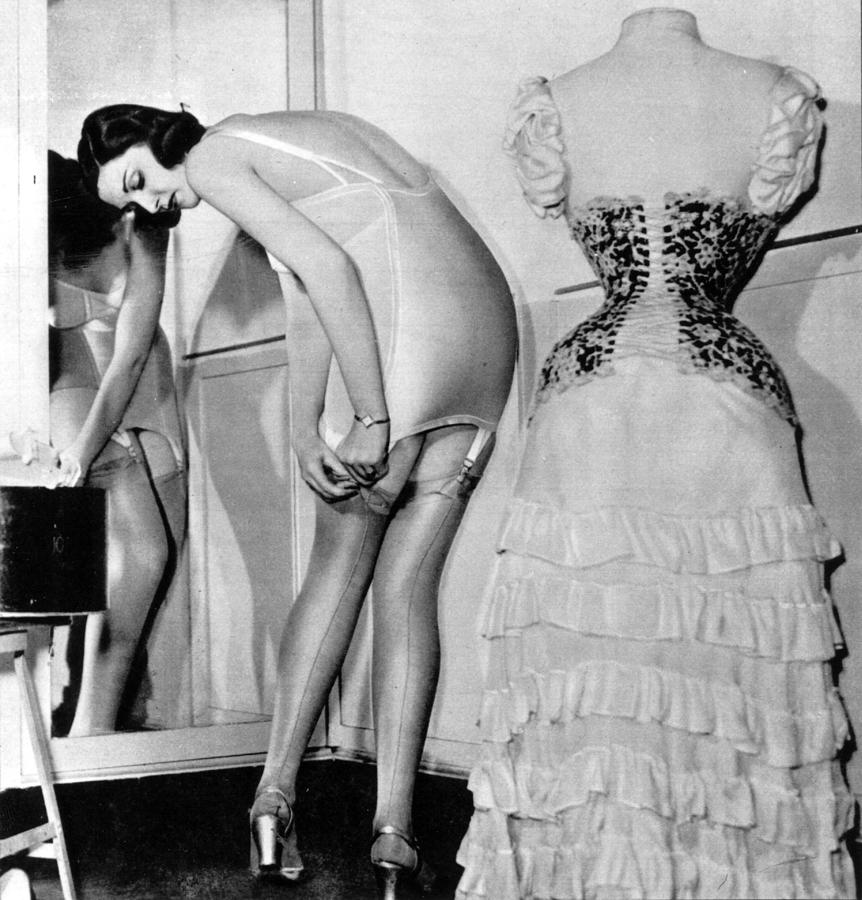 Black And White Photograph - Getting Dressed by Kurt Hutton