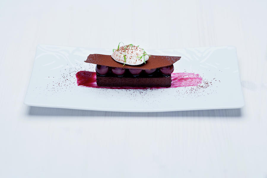 Gianduja Cake With Morello Cherry Compote And Vanilla Foam Photograph by Michael Wissing