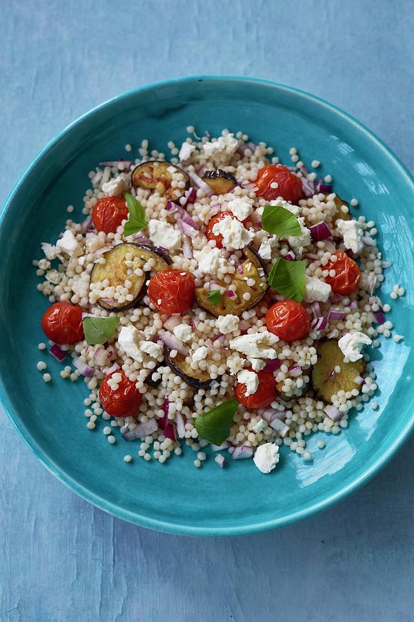Giant Couscous Salad With Aubergines, Tomatoes, Red Onions And Feta Cheese Photograph by Clive Streeter