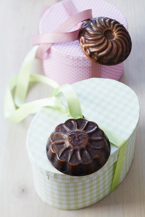 Gift Boxes Decorated With Small Cake Moulds Photograph by Franziska Taube