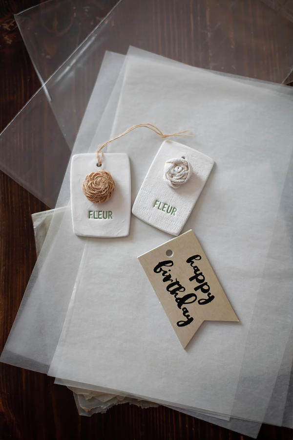 Vintage Photograph - Gift Tags With Flower Motifs And Birthday Greeting Lying On Tissue Paper by Alicja Koll