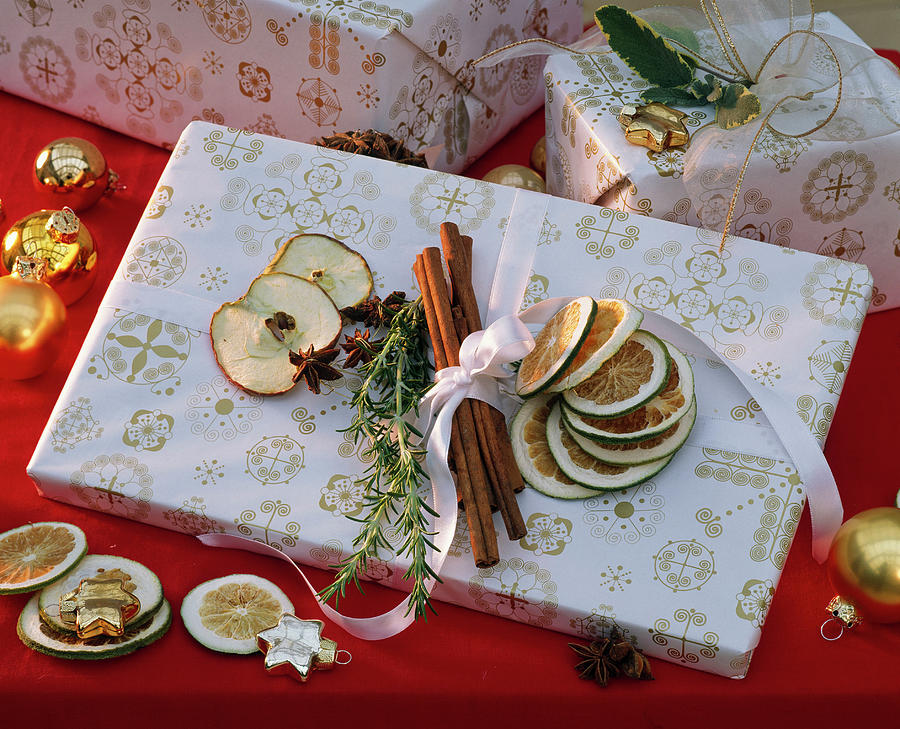 Gift With Citrus lime Slices, Cinnamon Sticks Photograph by Friedrich Strauss