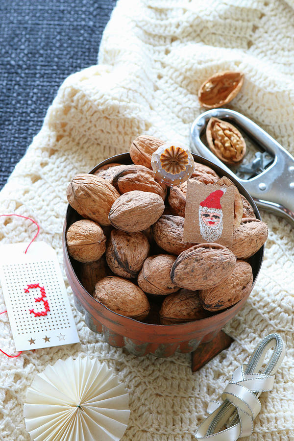 Gifts For St. Nicholas Day: Walnuts In Copper Cake Tin On Hand-crocheted Blanket Photograph by Regina Hippel