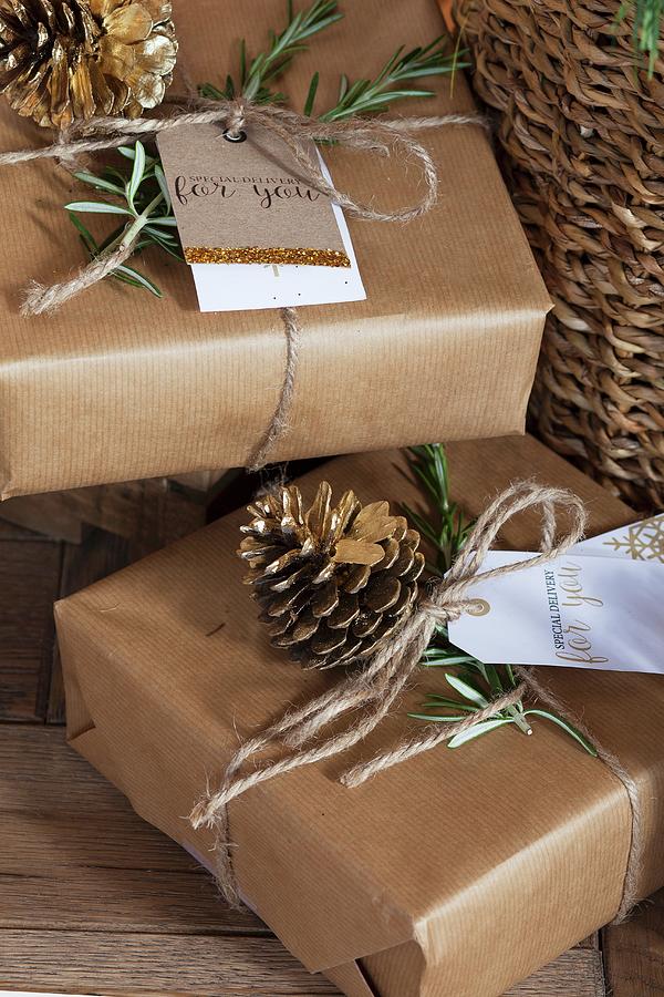 Gifts Wrapped In Brown Paper, Parcel String And Hand-made Gift Tags Photograph by Great Stock!