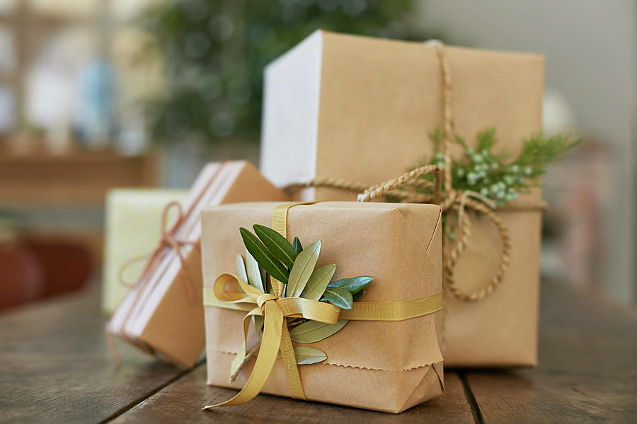 Gifts Wrapped In Brown Paper With Olive Leaves And Juniper Sprigs Photograph by Frdric Jacquet