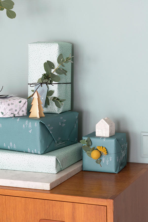 Gifts Wrapped In Shades Of Blue Decorated With Eucalyptus Sprigs Photograph by Marij Hessel