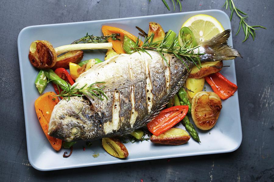 Gilt-head Bream With Rosemary On A Bed Of Oven-roasted Vegetables Photograph by Frank Weymann