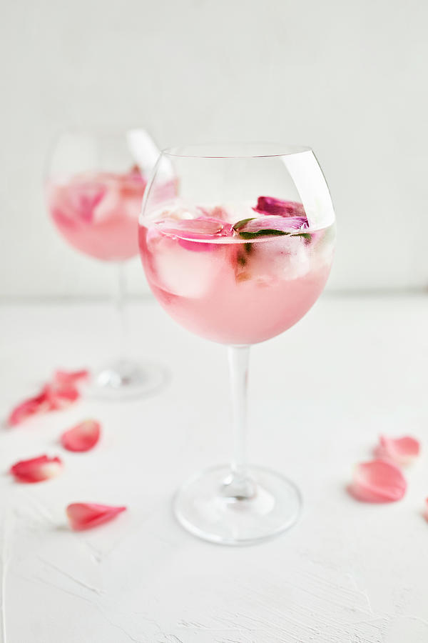 Gin And Tonic Cocktail With Rose Infused Tonic And Frozen Roses Photograph by Natasa Dangubic