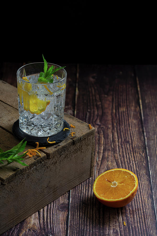 Gin And Tonic With Orange Photograph by Felix Kochbook