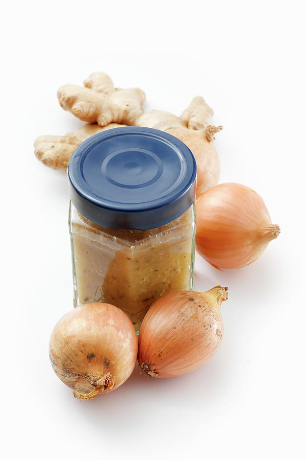 Ginger And Onion Jam In A Crew-top Jar On A White Surface Photograph by Petr Gross