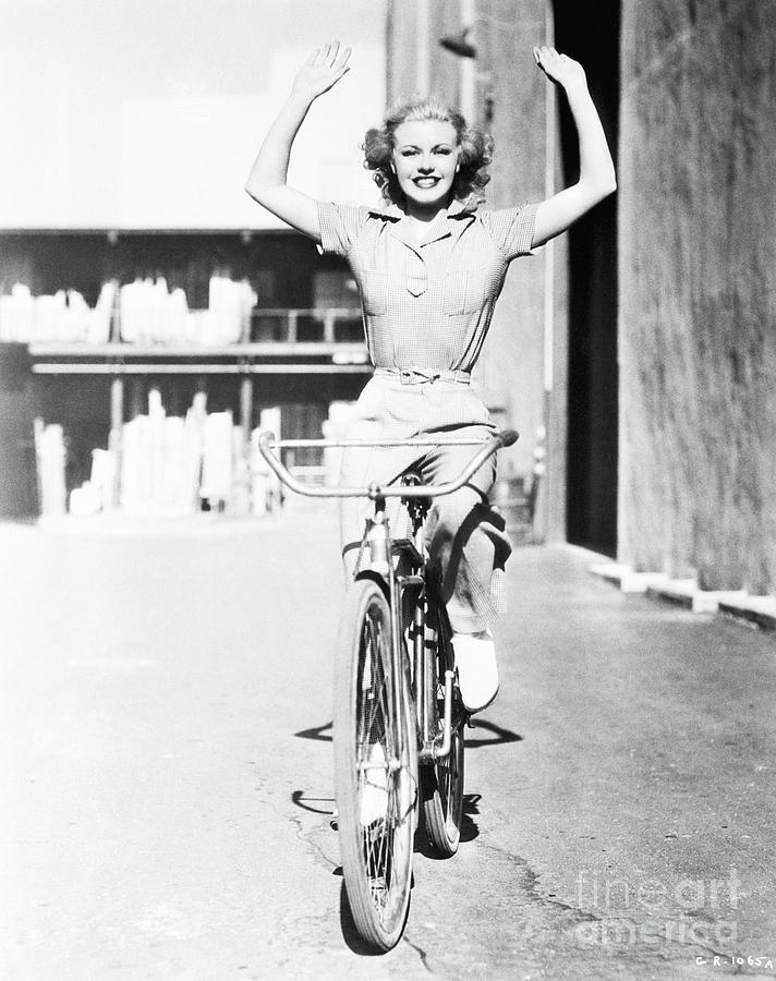 Ginger Rogers Riding A Bicycle Photograph By Bettmann Fine Art America