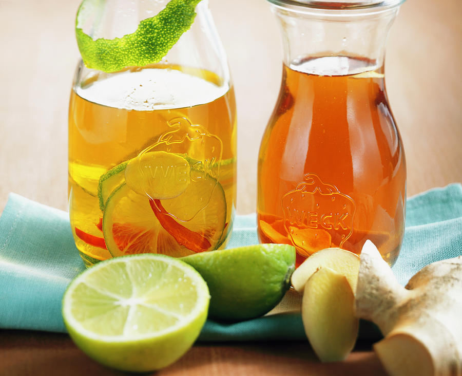 Ginger Vinegar And Ginger-lime Oil In Two Bottles Photograph by Teubner Foodfoto