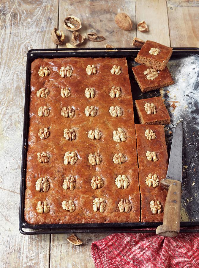 Gingerbread Cake With Walnuts On A Baking Tray Photograph by Nicolas Leser