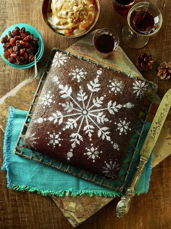 Gingerbread Christmas Cake With Icing Sugar Snowflake Pattern Photograph by Dan Jones