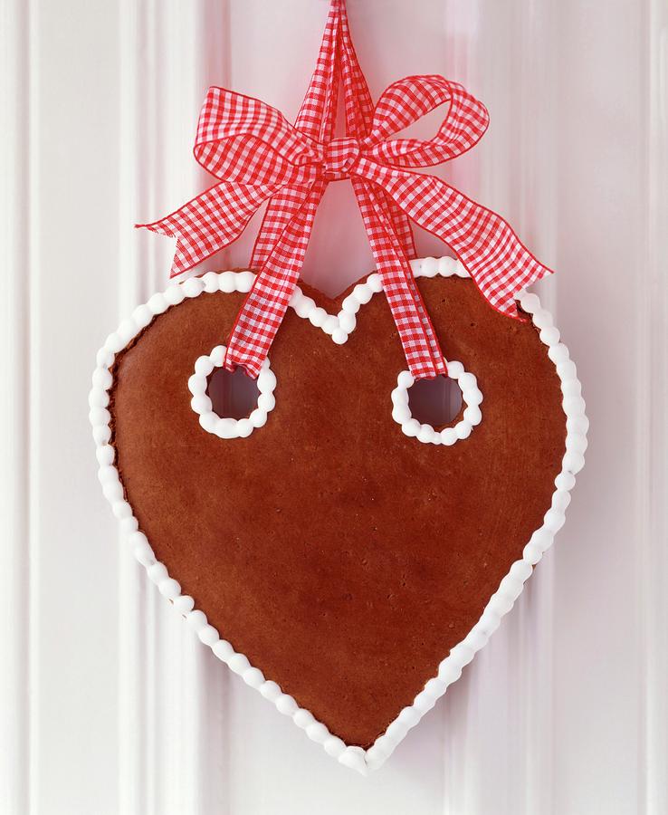 Gingerbread Heart With Simple Iced Trim Hung From Red And White Gingham Ribbon Photograph by Veronika Stark