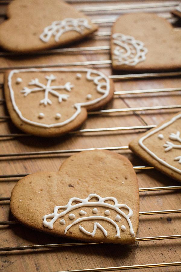 Gingerbread Hearts Decorated With White Icing Photograph by Alice Del Re